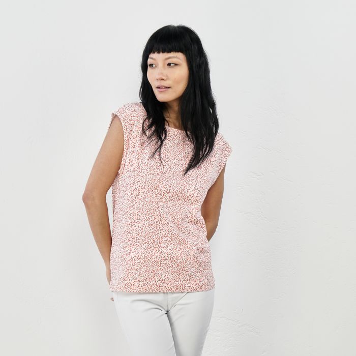 Top arancione smanicato fantasia floreale