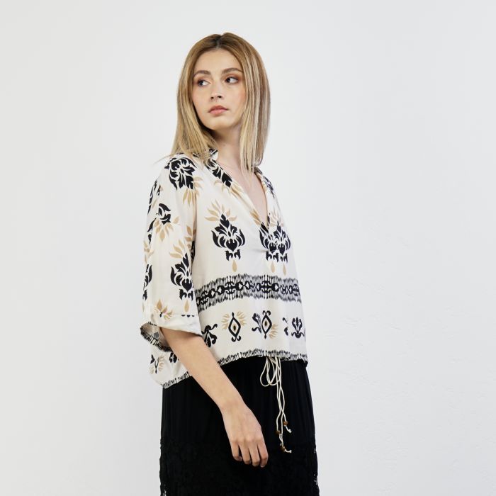 Blusa beige con stampa