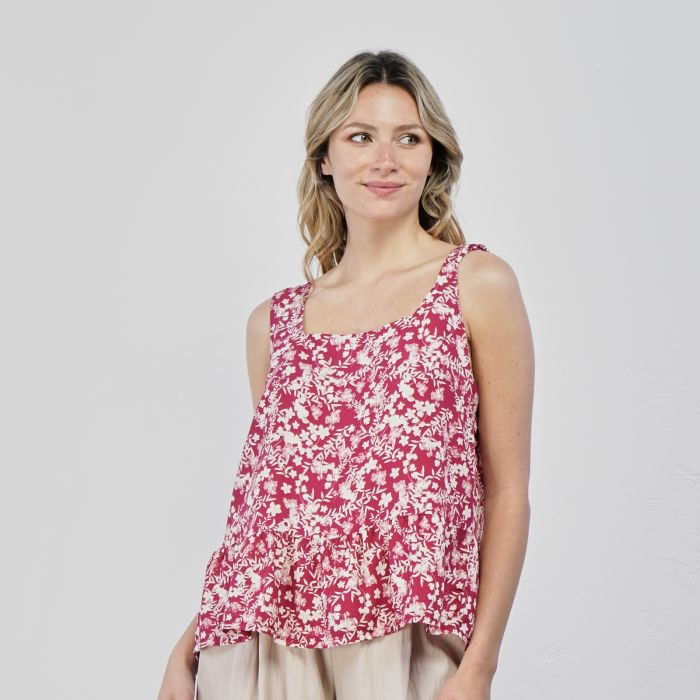 Top rosa con stampa floreale e volant