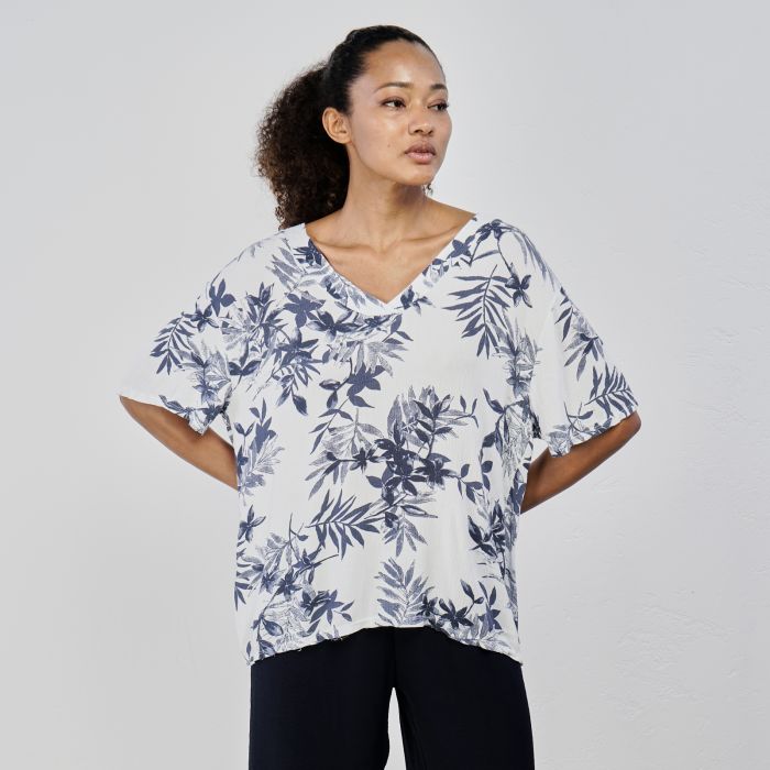 Blusa bianca oversize con stampa floreale