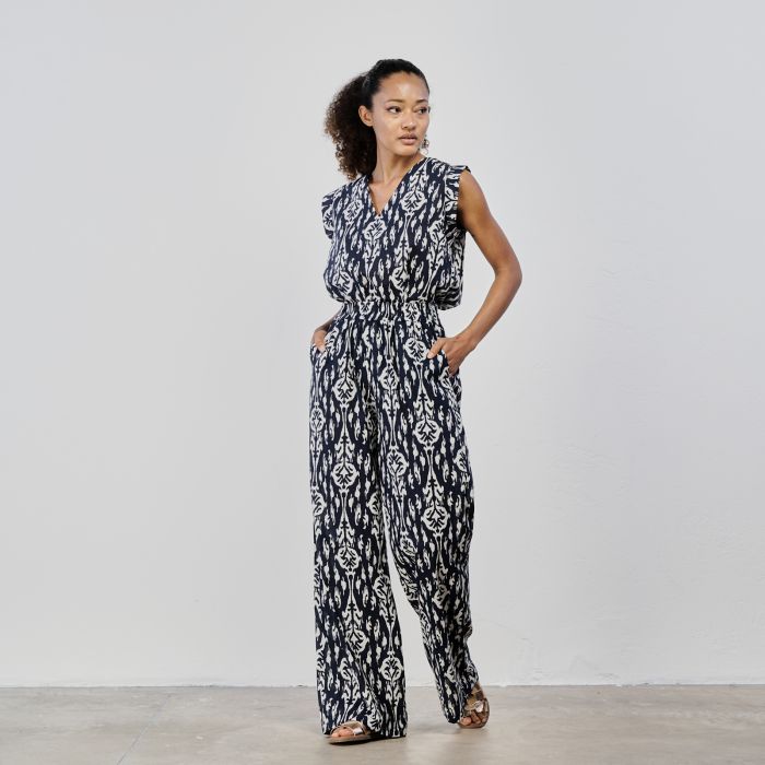 Top bianco e nero con scollo a V e stampa geometrica