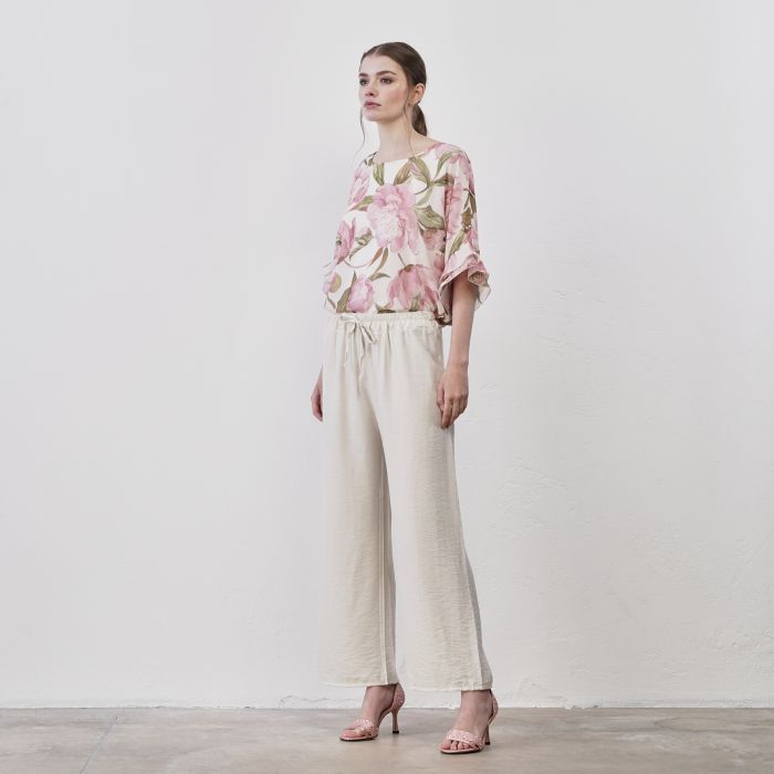 Pantaloni beige ampi da donna con coulisse in vita