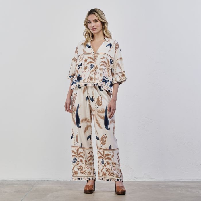 Pantaloni ampi beige da donna in stampa tropical