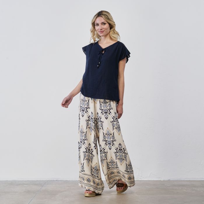 Pantaloni lunghi ampi beige da donna con stampa etnica