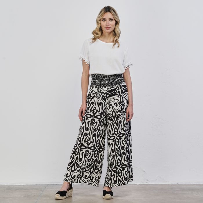 Pantaloni lunghi ampi neri e bianchi da donna in stampa etnica