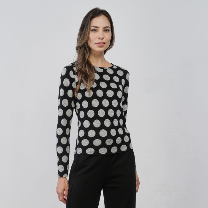 Maglia bianca e nera da donna con fantasia a pois