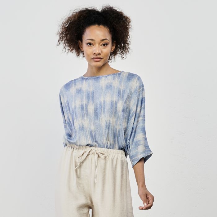 Maglia azzurra in tessuto glitterato