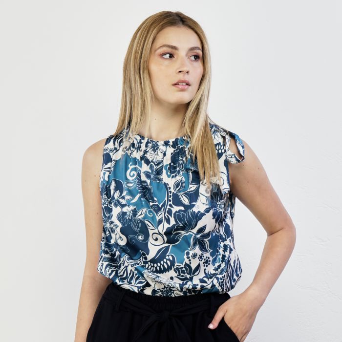 Top blu senza maniche con fiocco e stampa floreale