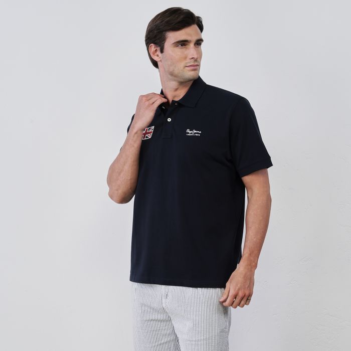 Polo blu da uomo in cotone con maniche corte e mini logo con bandiera