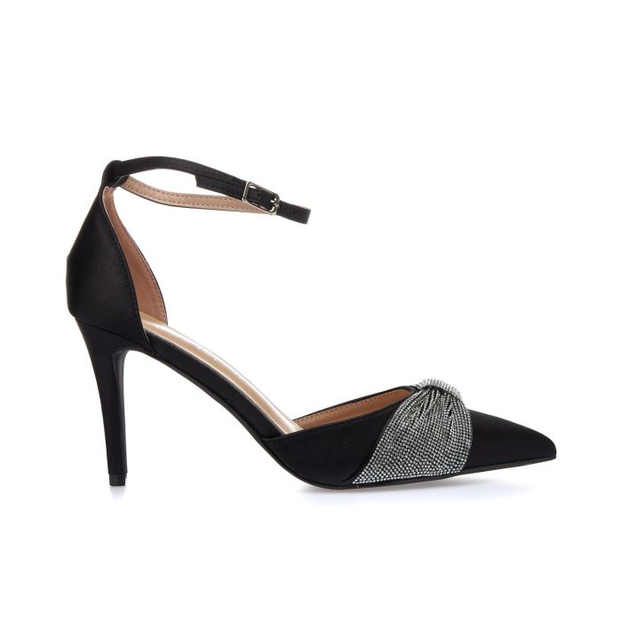 Decolletè nere a punta con tacco alto, cinturino e fiocco con strass